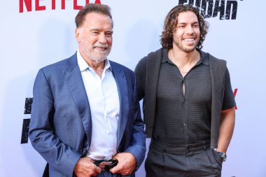 Avusturyalı ve Amerikalı aktör, eski Kaliforniya Valisi, iş adamı, eski politikacı ve eski profesyonel vücut geliştirici Arnold Schwarzenegger ve oğlu / Amerikan aktör ve fitness modeli Joseph Baena Netflix 'in Los Angeles Premiere' ine geldi.