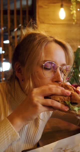 Young Blonde Woman Eating Fast Food Cafe Slow Motion Vertical — Video