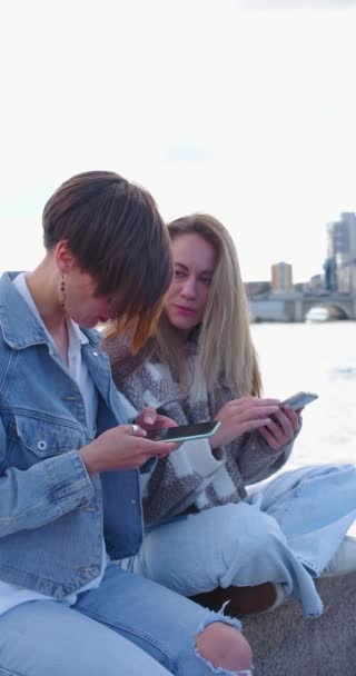 Lesbian Couple Sit Urban Environment Surf Phones Communicate Nicely Each — Stock video