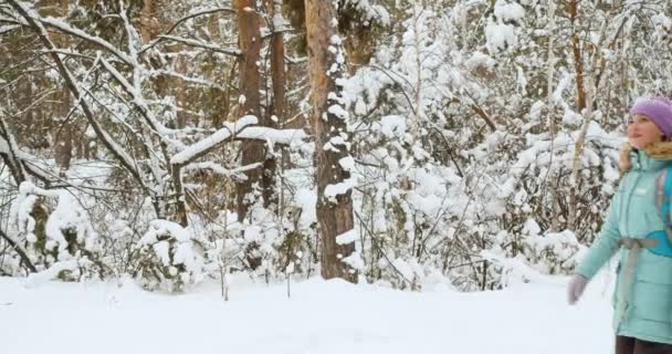 Two Female Tourists Walking Snow Covered Forest Winter Hiking Slow — Video Stock