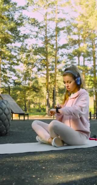 Young Woman Chooses Music Meditation Her Smart Watch Starts Meditating — Αρχείο Βίντεο