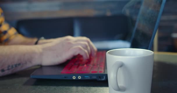 Male Hands Typing Keyboard Laptop Home Cup Coffee Foreground Freelancer — Video Stock