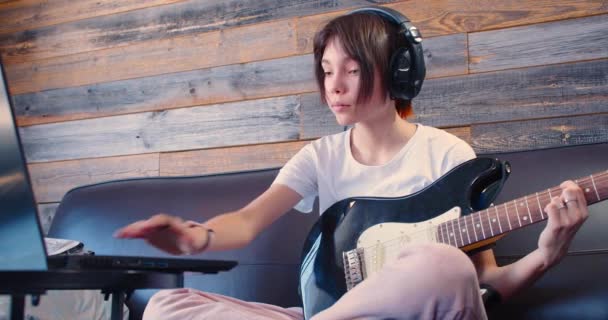 Slow Motion Footage Years Old Girl Guitar Headphones Front Laptop — Stockvideo