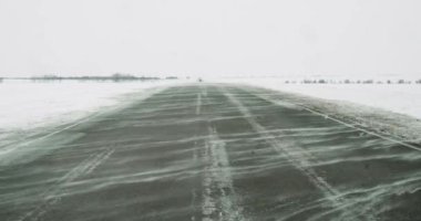 Video of the road in severe frosts and a snowstorm. Travel in extreme weather conditions. 4k footage.