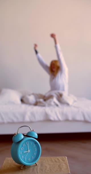 Vertical Footage Alarm Clock Foreground Blurred Young Blonde Woman Woke — Stock video