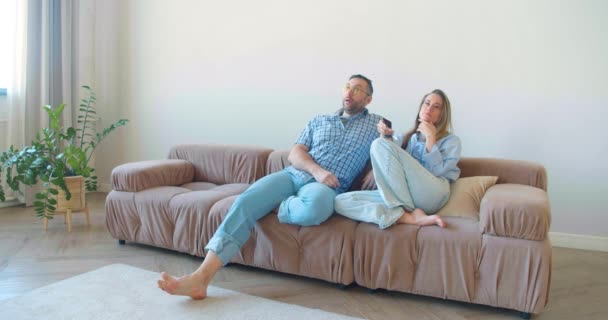 Middle Aged Heterosexual Couple Bored Look Sits Home Front Switches — Stock Video