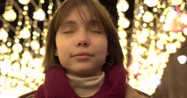 Teenage Girl Puts Large Wireless Headphones Looks Camera Smiles Backdrop — Stock Video