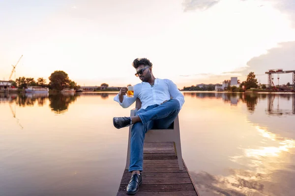 Young Man Pakistani Ethnicity Drinking Beer Sitting Quayside River Port — Stock Photo, Image