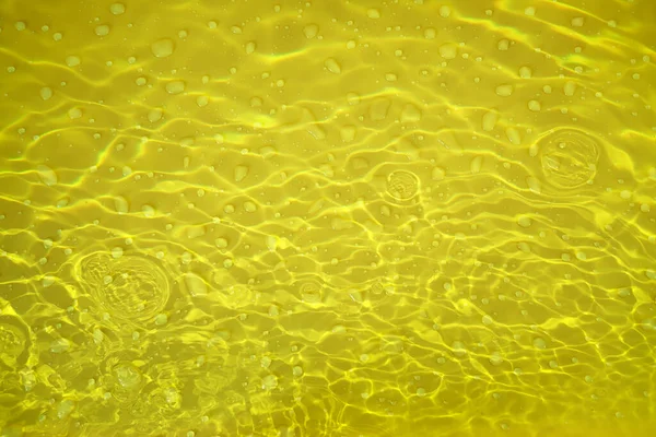 Desenfoque Borrosa Transparente Color Oro Claro Textura Superficie Del Agua —  Fotos de Stock