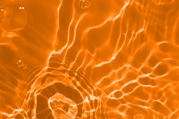 Defocus Verschwommen Transparent Orange Gefärbte Klare Oberflächenstruktur Des Wassers Mit — Stockfoto