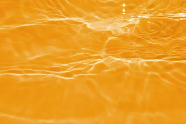Размытие Размыло Прозрачный Оранжевый Цвет Прозрачной Спокойной Текстуры Поверхности Воды — стоковое фото