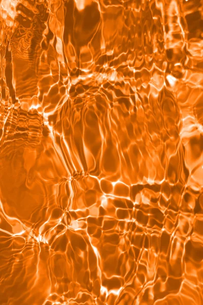 Defocus Blurred Transparent Orange Colored Clear Calm Water Surface Texture — Stock Photo, Image