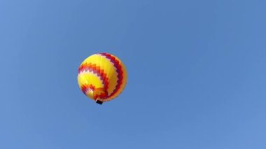 Hot air balloons over blue sky. Contains transparency. Hot air balloons isolated on blue sky.