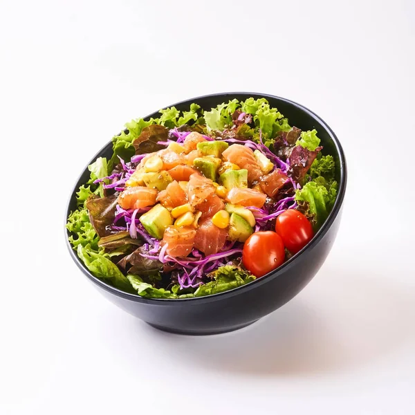 Close up healthy vegetables in black bowl isolated on white background. Healthy food concept