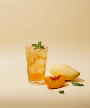 Close up a glass of orange juice isolated in light brown background