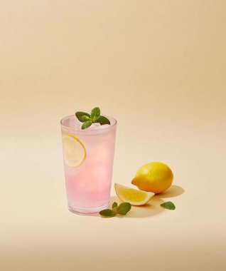 Close up a glass of orange juice isolated in light brown background