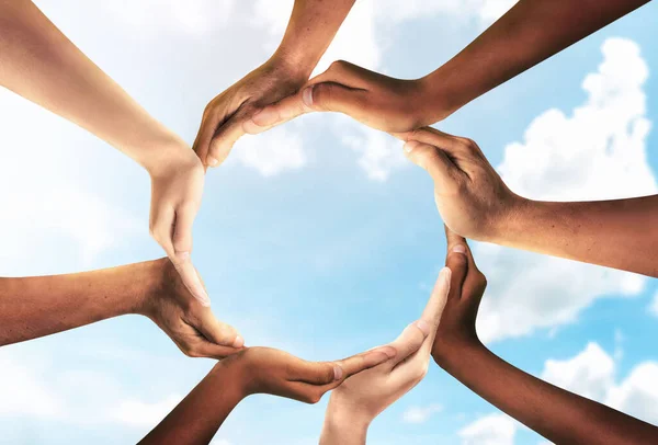 Symbol and shape of circle created from hands.The concept of unity, cooperation, partnership, teamwork and charity. diversity of a diverse group of people connected together as a supportive symbol.