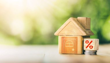 Mortgage rates business concept of investment housing real estate interest rates 3d home appraisal. planning savings money of coins to buy a home concept for property ladder, mortgage, real estate.