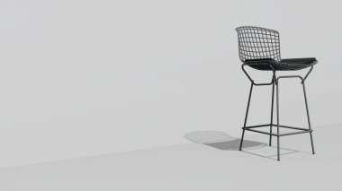 Siyah minderli beyaz bir sandalye beyaz bir duvarda oturuyor. Sandalye metalden yapılmıştır ve bir ağ tasarımına sahiptir. Sandalye modern ve şık, minimalist bir tasarımı var.