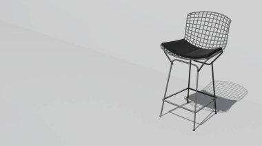 Siyah minderli beyaz bir sandalye beyaz bir duvarda oturuyor. Sandalye metalden yapılmıştır ve bir ağ tasarımına sahiptir. Sandalye modern ve şık, minimalist bir tasarımı var.