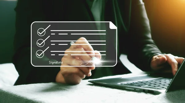 Electronic Signature Concept : Electronic Signing of Digital Documents on Virtual Laptop Screen