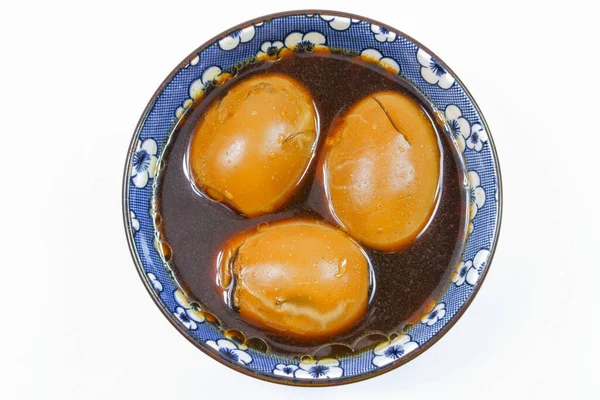 Thai Local Food Egg and Pork in Sweet Brown Sauce on White Background
