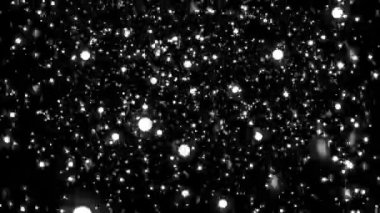 3 boyutlu kar tanecikleri siyah arkaplanda hareketli parçacıklar oluşturur.