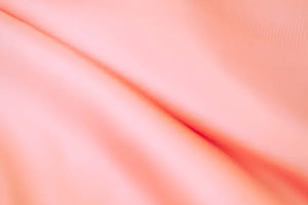 Stylish bright orange fabric stripes, blurred background