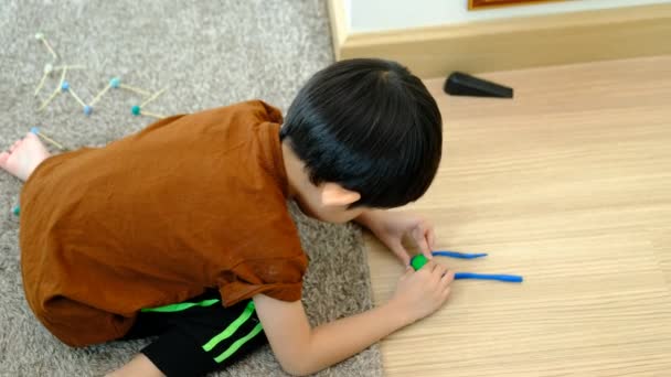 Asian Boy Playing Plasticine Room — Stock Video