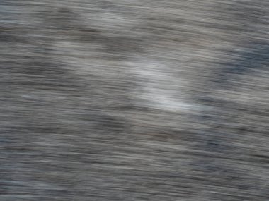 Hareket fotoğrafçılığıyla grunge arkaplan olarak kaba beton zemin üzerinde tam çerçeve soyut dokusu