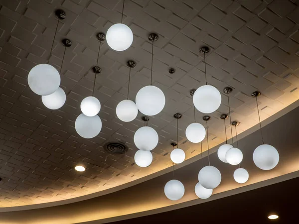 stock image Round lamp, hanging alternating high and low, decorating the ceiling