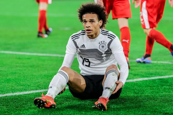 stock image Wolfsburg, Germany, March 20, 2019: German footballer Leroy San on ground after a foul during the international soccer game Germany vs Serbia in Wolfsburg