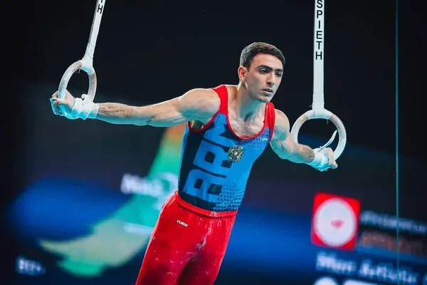 stock image Szczecin, Poland, April 10, 2019:male Armenian athlete Tovmasyan Artur competes on the rings during the European artistic gymnastics championships