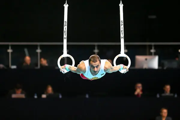 stock image Szczecin, Poland, April 10, 2019:olympic male Bulgarian athlete Marinov Isus competes on the rings during the European artistic gymnastics championships