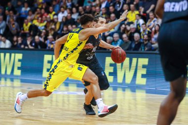 Oldenburg, Germany, November 20, 2019:EuroCup. Kevin McClain and Andrs Toto Forray in action during the match Baskets Oldenburg vs Basket Trento clipart