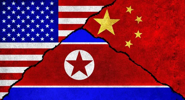 USA, China and North Korea flag together on wall. Diplomatic relations between United States of America, North Korea and China