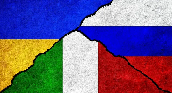 Russia, Ukraine and Italy flag together on wall. Diplomatic relations between Russia, Italy and Ukraine