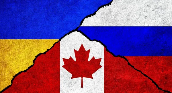 Russia, Ukraine and Canada flag together on wall. Diplomatic relations between Russia, Canada and Ukraine