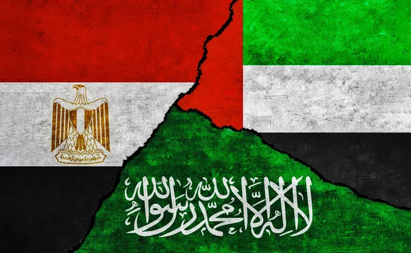 Saudi Arabia, Egypt and UAE painted flags on wall with crack. United Arab Emirates, Egypt and Saudi Arabia relations