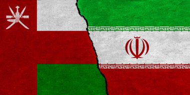 İran ve Umman bayrağı dokulu duvarda birlikte. Umman ve İran arasındaki ilişkiler