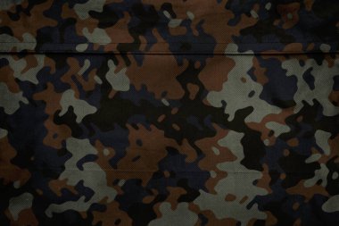 Askeri branda dokusu, ordu kamuflaj tekstil arka planı, kamuflaj kumaş örgüsü deseni