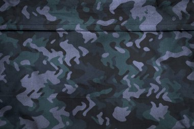 Askeri branda dokusu, ordu kamuflaj tekstil arka planı, kamuflaj kumaş örgüsü deseni
