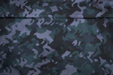 Askeri branda dokusu, ordu kamuflaj tekstil arka planı, kamuflaj kumaş örgüsü deseni