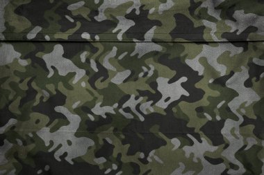 Askeri branda dokusu, ordu kamuflaj tekstil arka planı, kamuflaj kumaş örgüsü deseni