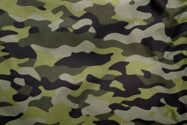 Açık hava kamuflaj örgüsü, askeri branda deseni, kamuflaj kumaşı dokusu, ordu tuvali arka planı.