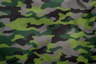 Açık hava kamuflaj örgüsü, askeri branda deseni, kamuflaj kumaşı dokusu, ordu tuvali arka planı.