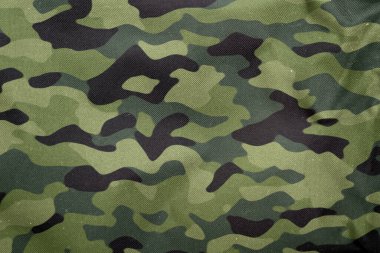 Açık hava kamuflaj örgüsü, askeri branda deseni, kamuflaj kumaşı dokusu, ordu tuvali arka planı.