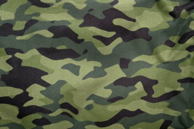 Açık hava kamuflaj örgüsü, askeri branda deseni, kamuflaj kumaşı dokusu, ordu tuvali arka planı.