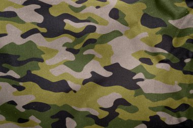 Açık hava kamuflaj örgüsü, askeri branda deseni, kamuflaj kumaşı dokusu, ordu tuvali arka planı.