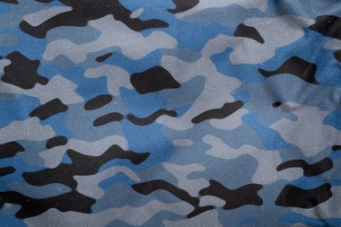 Açık hava kamuflaj örgüsü, askeri branda deseni, kamuflaj kumaşı dokusu, ordu tuvali arka planı.